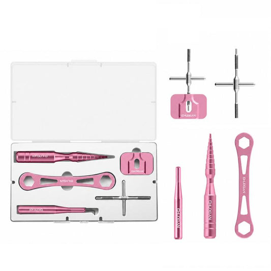 Pink aluminum fishing reel tool kit with tools and open white storage case