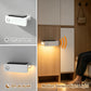 White motion-sensor nightlight sconce on wall, warm glow with motion detection
