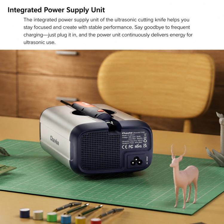 Handheld ultrasonic cutting knife with integrated power unit on work mat, showing control ports