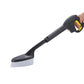 Wheel cleaning brush attachment held in hand, black handle and white bristles