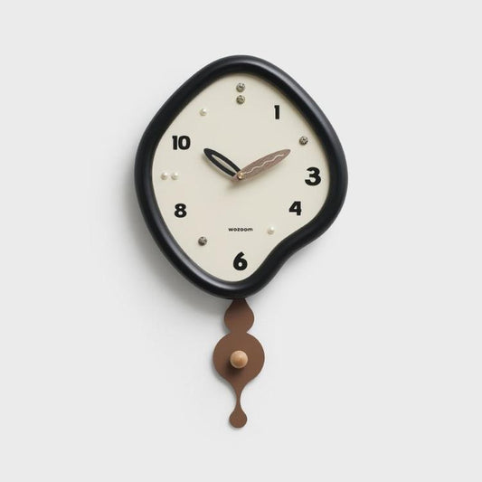 Black irregular pendulum wall clock with cream dial and bronze-brown weights