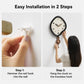 Person installs wall clock by hanging the irregular pendulum clock on a hook