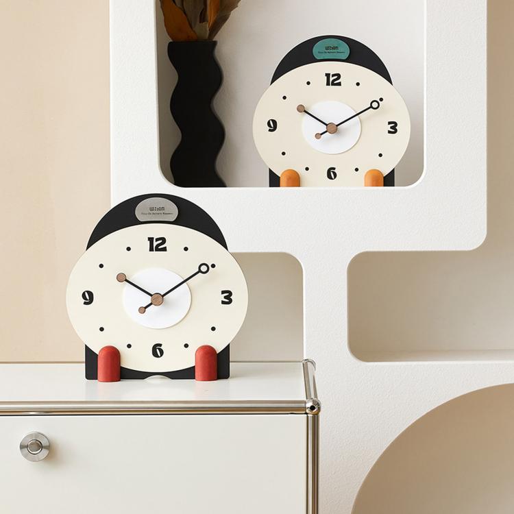 Two small mantel table clocks with cream dials, colorful side pegs