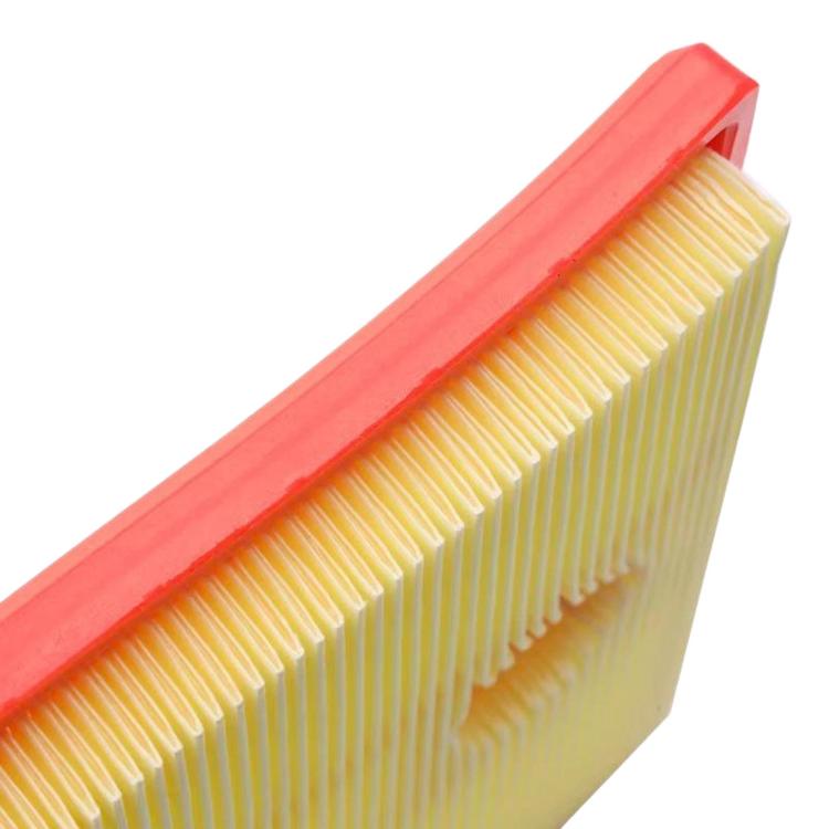 Cabin air filter close-up of yellow pleated media and red frame edge