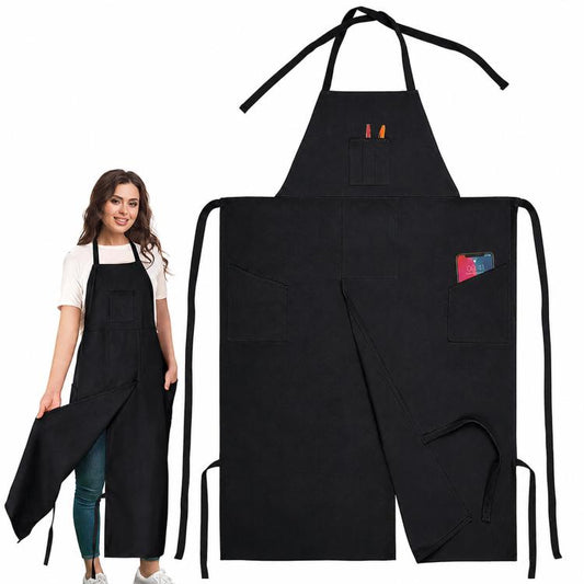 Black split-leg canvas work apron with halter neck, front pockets, and leg straps