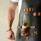 Black waterproof BBQ apron detail with bottle holster, rings, and leather pocket panels