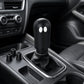 Black ghost car gear shift head decoration with two white eye cutouts on leather boot