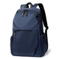 Slim blue laptop backpack with front flap, zip pockets, and padded shoulder straps.