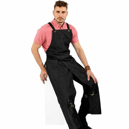 Black denim split-leg work apron with cross-back straps and front utility pockets.