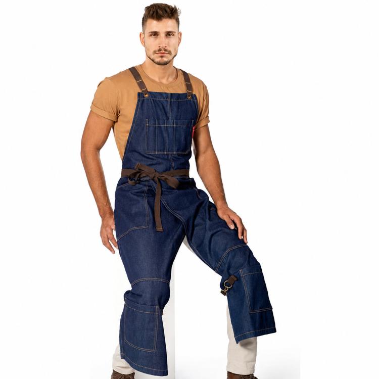 Denim blue split-leg cross-back work apron with tie waist and utility pockets.