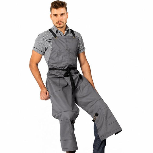 Gray work apron with cross-back straps and split-leg design plus utility pockets.