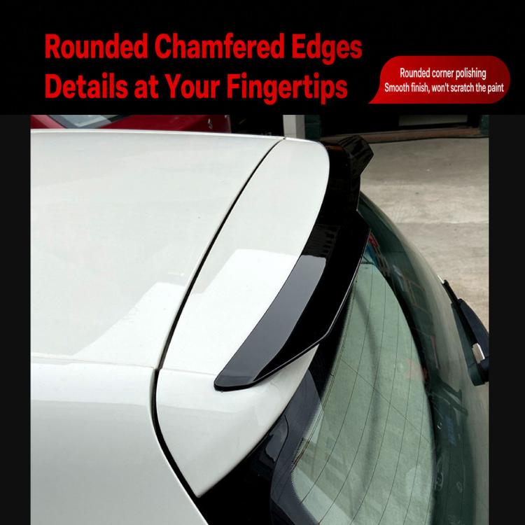 Installed rear roof spoiler on car roof edge, dark black rounded edges