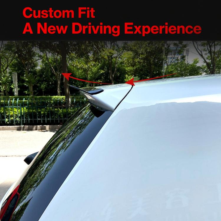Installed rear roof spoiler on vehicle roof edge, dark black curved design