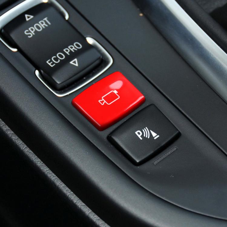 Red rear camera switch button on car center console panel