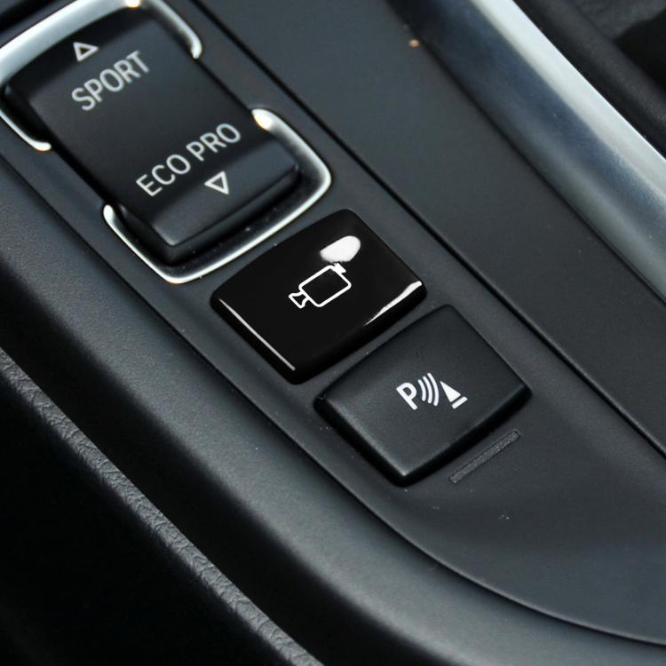 Black rear camera switch button with white outline icon