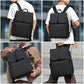 Black laptop backpack worn on back with top flap front buckle closure