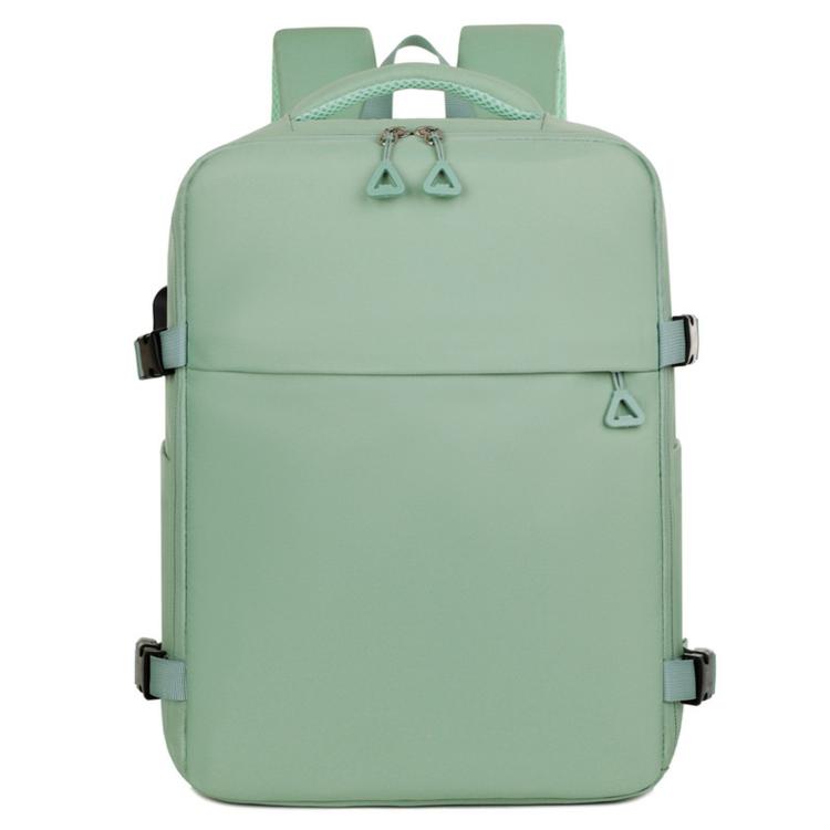 Green laptop backpack with top handle, front flap pocket, and adjustable shoulder straps.