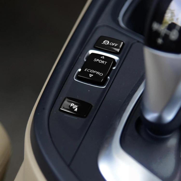 Red chassis gear button set on center console with OFF, SPORT, ECOPRO and P buttons