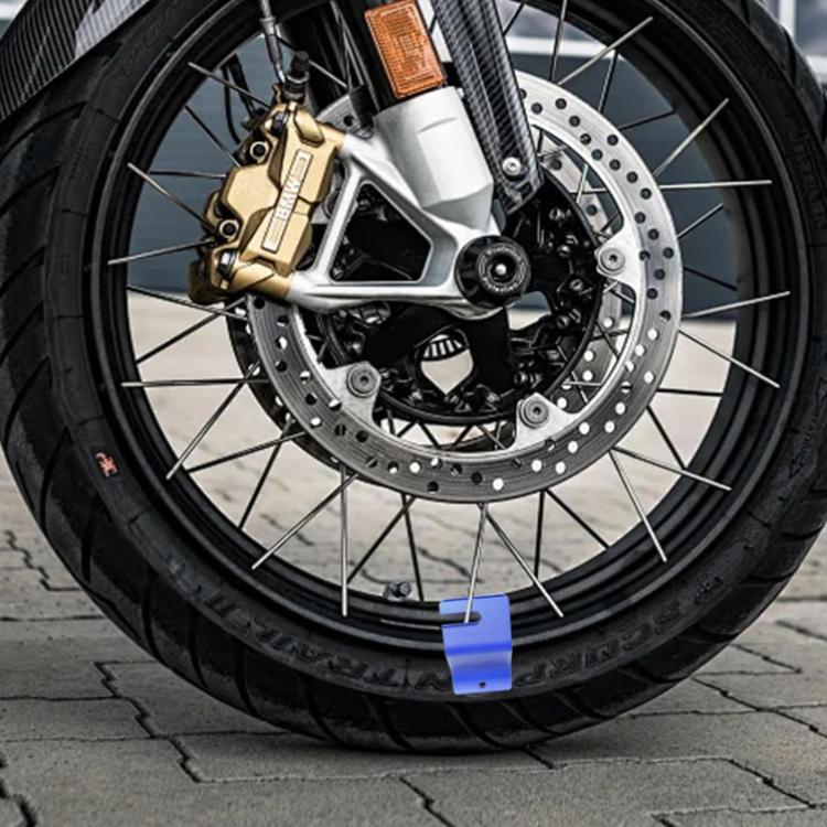 Blue motorcycle tire bead installation bracket secured on motorcycle front tire rim