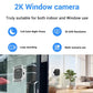 2K window camera shown mounted on a glass window, compact dual-bracket style