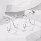 Silver-tone charm hoop earrings set with paw and star details