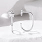 Silver-tone star charm hoop earring with hinged clasp