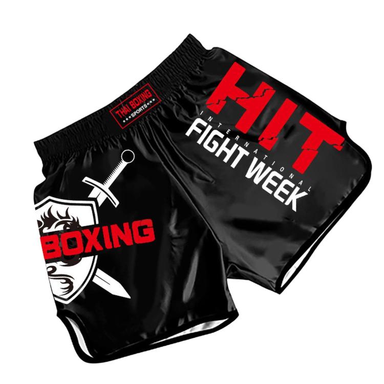 Muay Thai boxing shorts, black with red graphics and “Fight Week” print