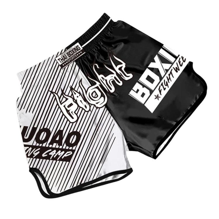 Muay Thai boxing shorts with black-and-white panels, “THAT BOXING” logo and JOUAO print.
