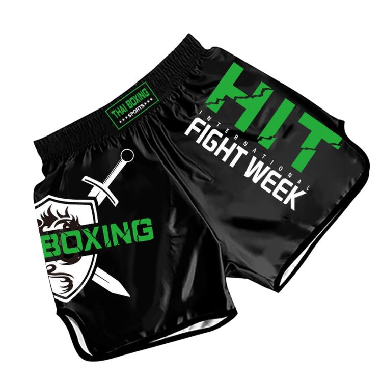 Black boxing shorts with green graphic text and That Boxing sportswear tag