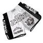 Muay Thai boxing shorts in white and black with Thai Boxing text and rose emblem.