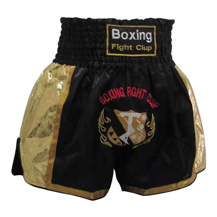 Muay Thai boxing shorts in black with gold satin panels and Boxing Fight Club label