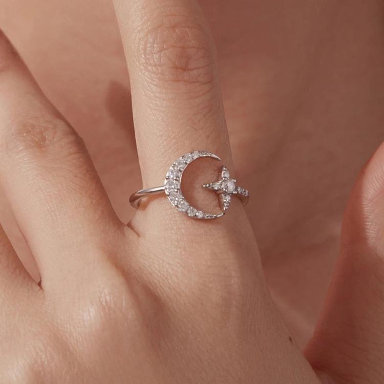 Sterling silver adjustable ring with round moissanite and star motif band