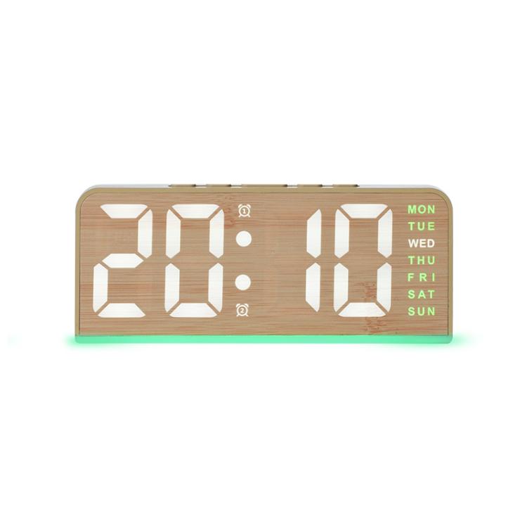 Digital alarm clock in light wood case with white time display and green bottom glow