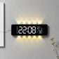 Curved digital LED wall clock with black frame, white numbers and warm yellow backlight.