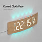 Curved digital LED wall clock with wood frame, angled view with bright cyan numbers and glow.