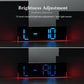 Black digital LED wall clock brightness adjustment with blue digits on RGB light strip