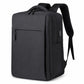 Black laptop backpack with top handle, front zip pocket, and padded shoulder straps