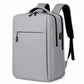 Light gray laptop backpack with front zipper, side pocket, and padded carry handles