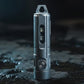 Gray metal flashlight keychain standing upright with top carry loop and side lens