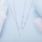 Y-shaped necklace set with four-leaf clover charms and crystal-studded chain
