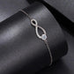 Sterling silver infinity loop bracelet with round gemstone drops on link chain