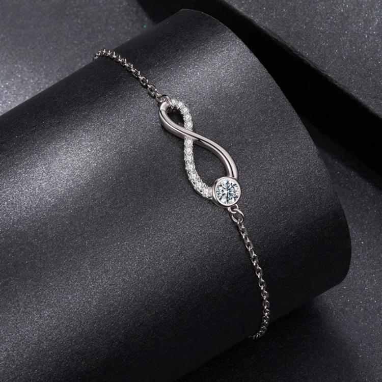 Sterling silver infinity loop bracelet with round gemstone drops on link chain