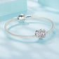 Heart charm beads on a silver-tone chain bracelet with pink crystal accents