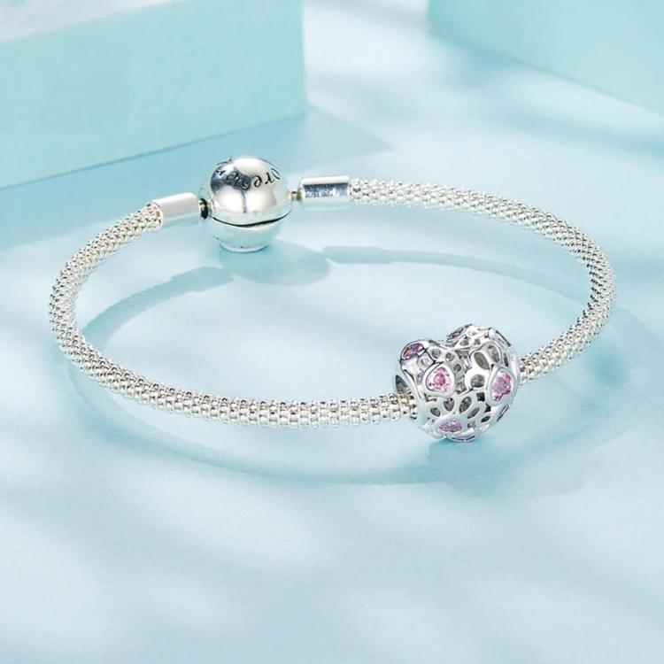 Heart charm beads on a silver-tone chain bracelet with pink crystal accents