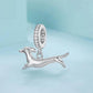 Running dachshund charm pendant hanging from a crystal-studded oval ring, silver-tone