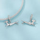 Running dachshund charm pair with crystal-studded hoops, silver-tone finish