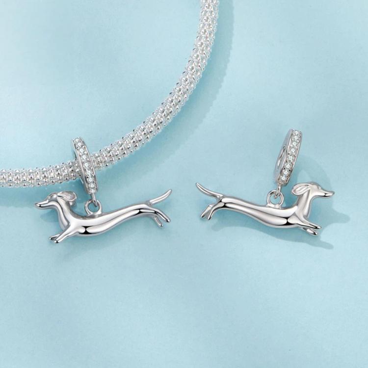 Running dachshund charm pair with crystal-studded hoops, silver-tone finish