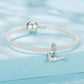 Sparkly mesh bracelet with a running dachshund charm and crystal hoop, silver-tone