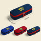 Navy-blue pencil case with U crest patch and red zipper trim; shown with other sizes