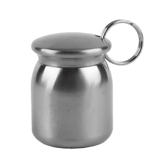 Metal pill case keychain with circular ring, polished gray finish and snap lid.